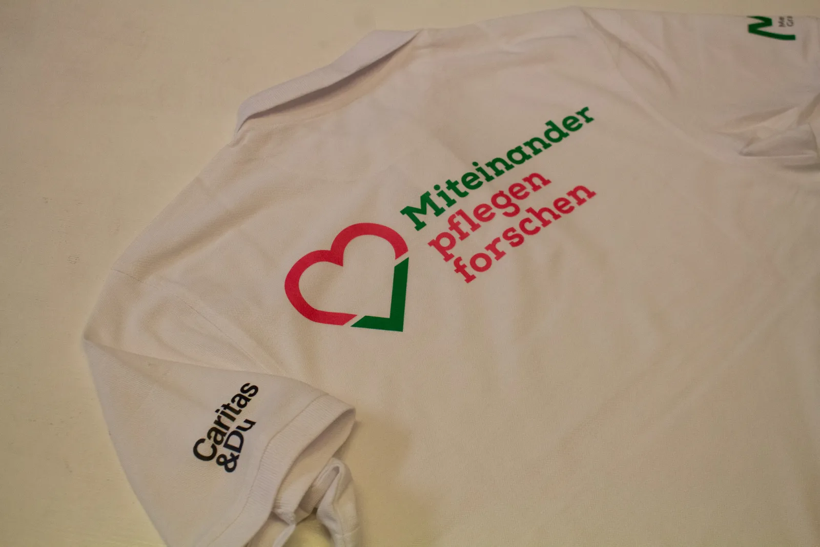 Caritas & Med Uni - Poloshirts — Bild 1